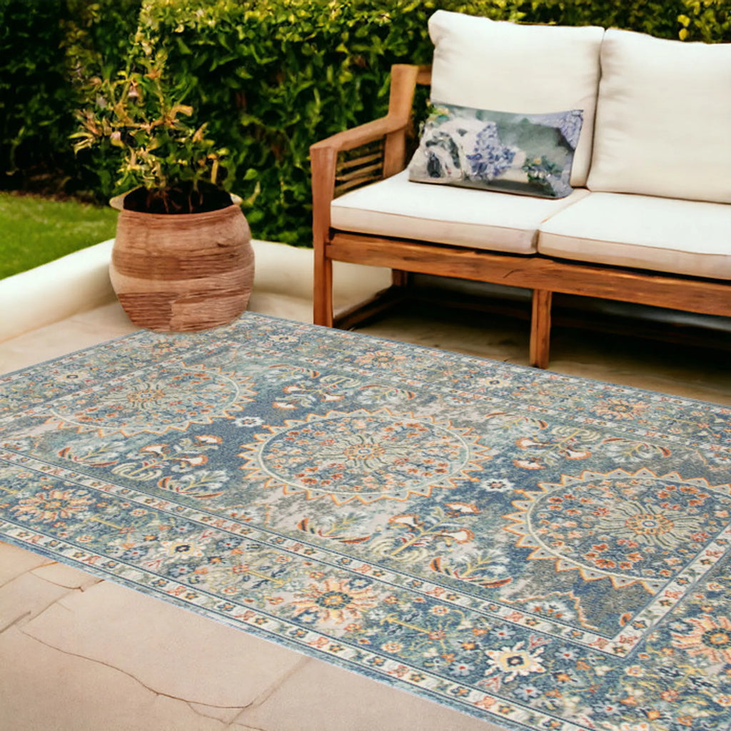 9′ X 12′ Blue and Orange Floral Medallion Stain Resistant Indoor Outdoor Area Rug
