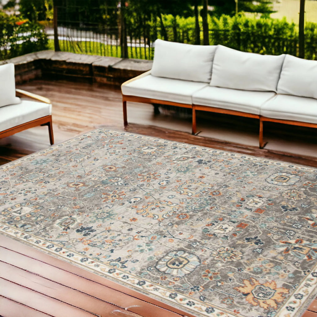 9′ X 12′ Blue and Orange Floral Stain Resistant Indoor Outdoor Area Rug