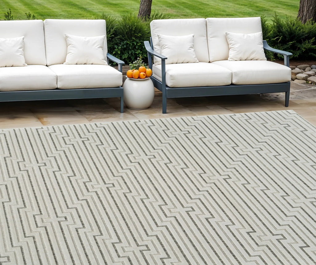 6′ X 9′ Cream and Beige Geometric Distressed Indoor Outdoor Area Rug