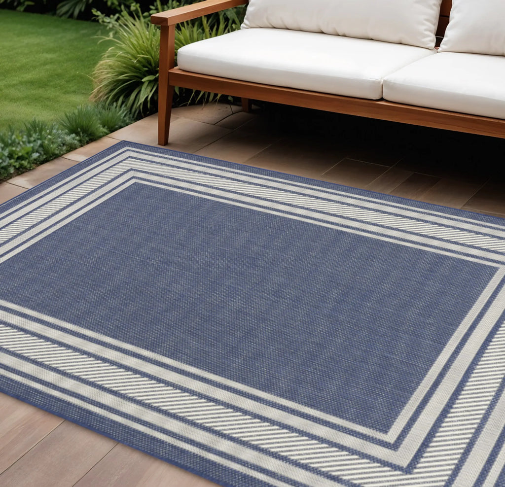 6′ X 9′ Navy Blue And Ivory Geometric Indoor Outdoor Area Rug