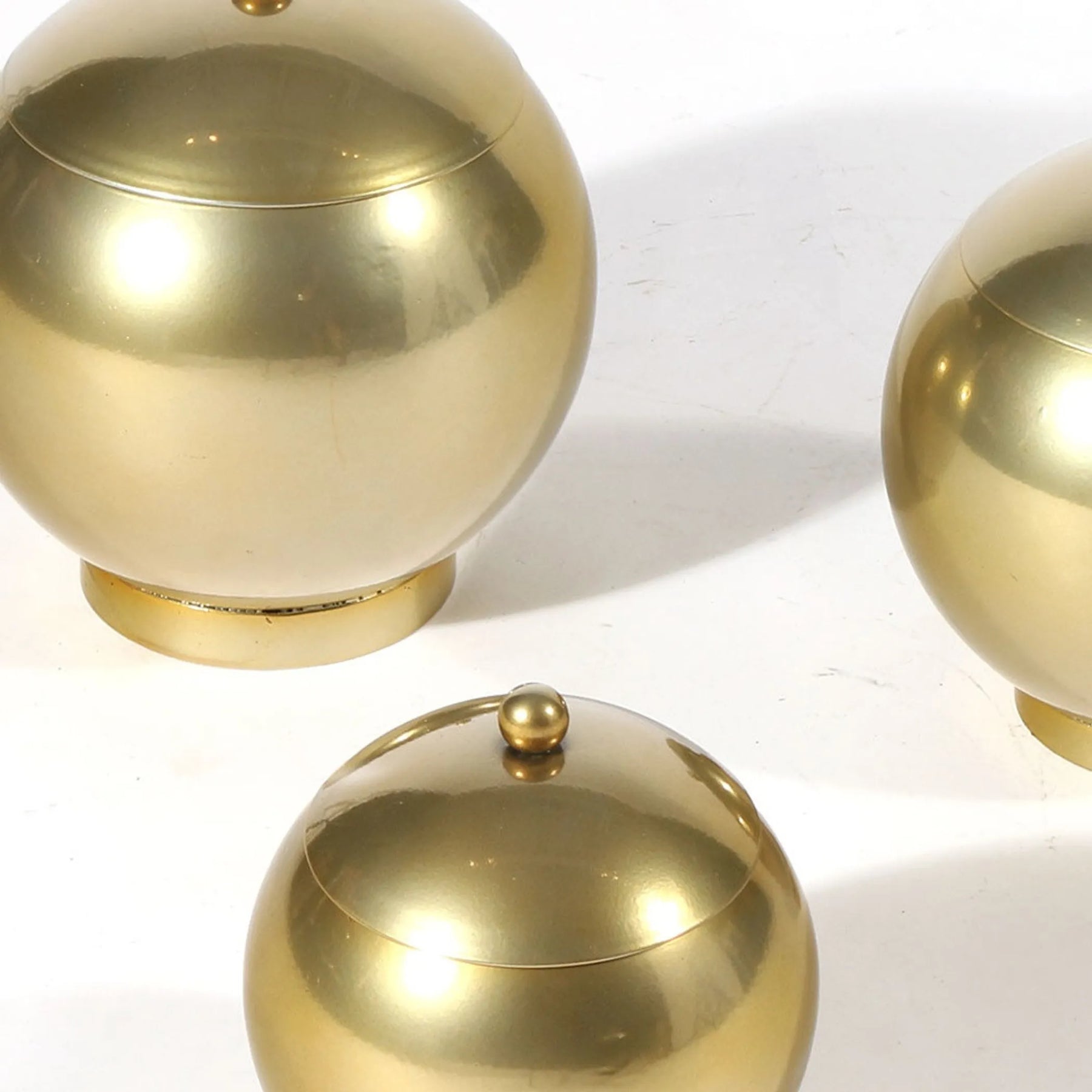 Set of Three Gold Metal Decorative Lidded Canisters — view 4