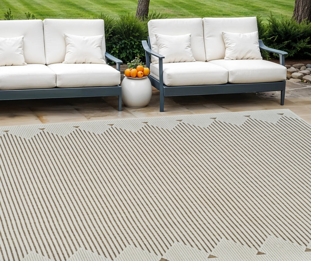 6′ X 9′ Beige and Brown Geometric Distressed Indoor Outdoor Area Rug