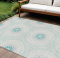 10′ X 14′ Teal Blue Beige And Ivory Floral Medallion Washable Indoor Outdoor Area Rug